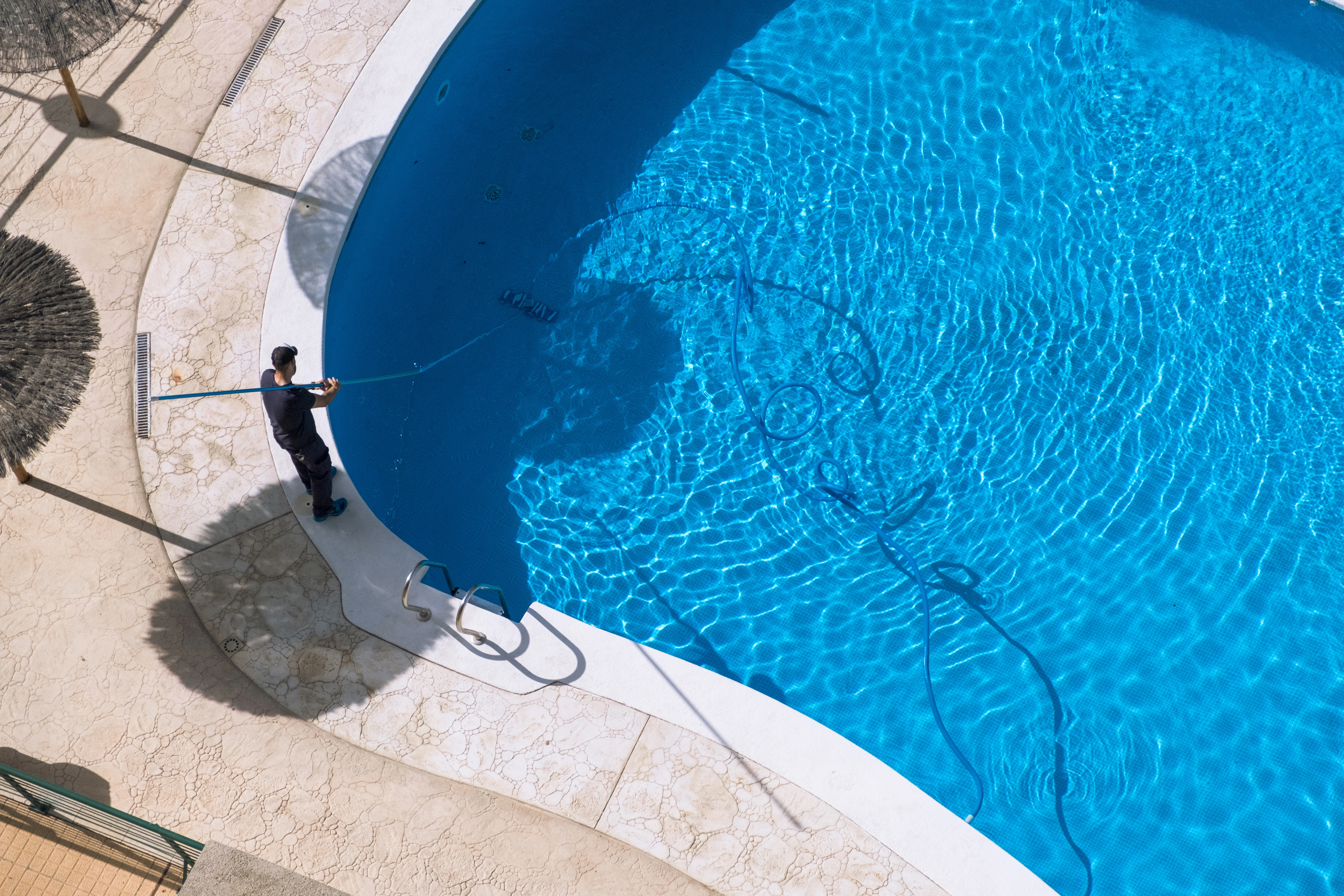 Pool cleaning professional maintaining a clear and efficient system